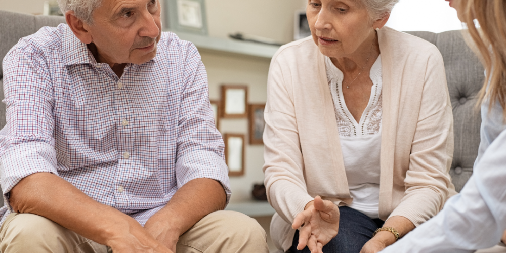 PHH Solicitors An elderly couple talking to a PHH Solicitor about a Deputyship Order.