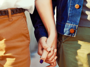 A cohabiting couple holding hands. PHH Solicitors Fylde Coast. A cohabiting couple holding hands. PHH Solicitors Fylde Coast.