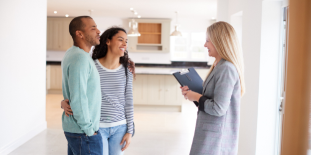 Couple being helped by a PHH conveyancing solicitor when buying and selling property.