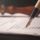 Why making a Will is important – signing a legal Will document with a pen, PHH Solicitors