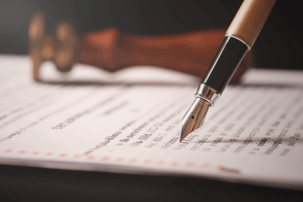 Why making a Will is important – signing a legal Will document with a pen, PHH Solicitors